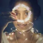 ULTIMATE guide to indoor Christmas lights lady with lights