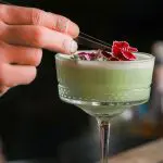 pic of a Christmas cocktail with the final touches being added