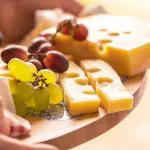 Pic of cheese and grapes on a Christmas cheese board - Your guide to great Christmas cheeseboards