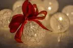 Pic of baubles and red ribbon to illustrate an article about timeless decorations for Christmas