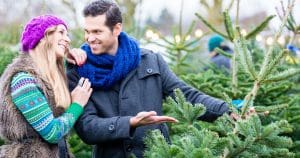 Man and won choosing a christmas tree - christmas.co.uk