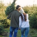 couple looking for popular christmas trees
