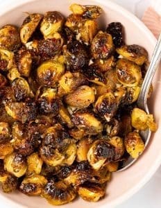 pic of caramelised brussels sprouts - a vegan side dish to enjoy on Christmas Day christmas.co.uk