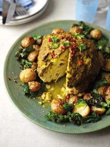 Pic of whole roast cauliflower - vegan side dishes to enjoy on Christmas Day christmas.co.uk