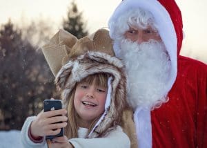 Pic of Father Christmas having a selfie with a girl