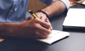 pic of man making a plan to tackle christmas day chores christmas.co.uk