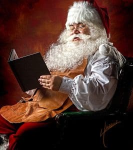 pic of santa reading a letter from a child write to santa uk christmas.co.uk