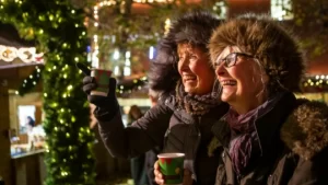 Pic of two ladies enjoying mulled wine at York Christmas market 