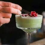 pic of a Christmas cocktail with the final touches being added