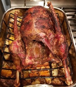 pic of a roasted goose resting before carving