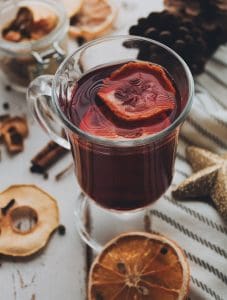 Pic of fruit in a glass of mulled wine - Mulled wine at Christmas – recipes and history