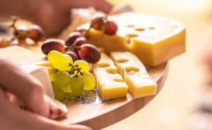 Pic of cheese and grapes on a Christmas cheese board - Your guide to great Christmas cheeseboards 