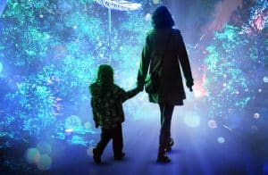 Pic of a mother and child at the light show at Kew to illustrate an article about Christmas experiences