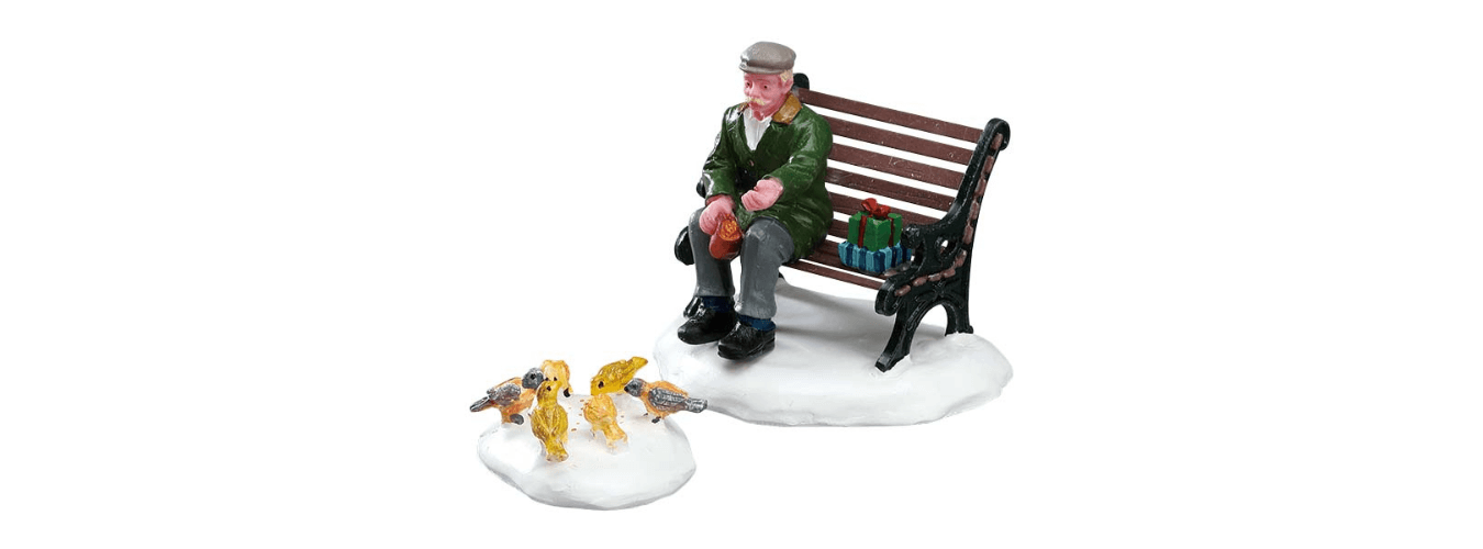 Lemax Caddington village figurine of a man sitting on a bench feeding pigeons