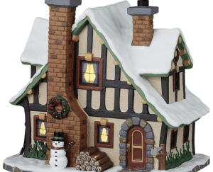 Lemax Caddington Village Winter holiday lodge which is a Victorian building with snow and logs christmas.co.uk